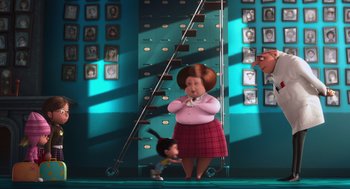 Movie still from “Despicable Me” (2010), directed by Pierre Coffin – An animated character is standing next to an animated character; Wide shot, High angle