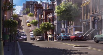 Movie still from “Despicable Me” (2010), directed by Pierre Coffin – An illustration of a street with cars parked on the side of the road; Extreme Wide shot, High angle