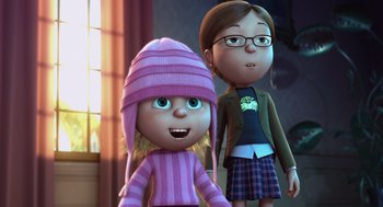 Movie still from “Despicable Me” (2010), directed by Pierre Coffin – Two animated characters are standing next to each other; Medium shot, Over the shoulder angle