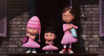 Movie still from “Despicable Me” (2010), directed by Pierre Coffin – A group of cartoon characters dressed in pink; Wide shot, Low angle