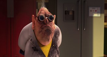 Movie still from “Despicable Me” (2010), directed by Pierre Coffin – An old man wearing a white lab coat and yellow shirt; Close Up shot, Over the shoulder angle