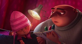 Movie still from “Despicable Me” (2010), directed by Pierre Coffin – An animated scene of a man and a woman looking at a pill bottle; Medium shot, Low angle