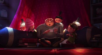 Movie still from “Despicable Me” (2010), directed by Pierre Coffin – A group of people sitting on a floor with books; Wide shot, Low angle