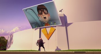 Movie still from “Despicable Me” (2010), directed by Pierre Coffin – A man is standing on the side of a building; Extreme Wide shot, Low angle