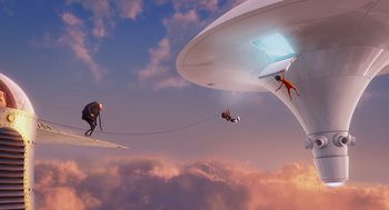 Movie still from “Despicable Me” (2010), directed by Pierre Coffin – Two people on surfboards and one on a surfboard in the sky; Extreme Wide shot, Low angle