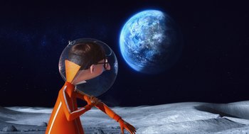 Movie still from “Despicable Me” (2010), directed by Pierre Coffin – An animated character is standing on the moon with an earth in the background; Wide shot, High angle