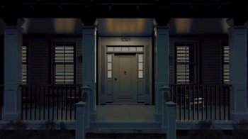Movie still from “Creep” (2014), directed by Patrick Brice – The front door of a house lit up at night; Wide shot, Low angle