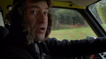 Movie still from “Creep” (2014), directed by Patrick Brice – A man in a car with a fur hat on; Close Up shot, Over the shoulder angle