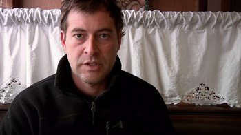 Movie still from “Creep” (2014), directed by Patrick Brice – A person wearing a black jacket; Close Up shot, Low angle