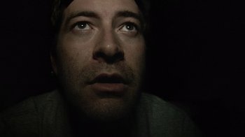 Movie still from “Creep” (2014), directed by Patrick Brice – A person looking up at the sky; Close Up shot, Overhead angle