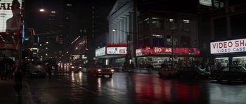 A city street at night lit up by street lights