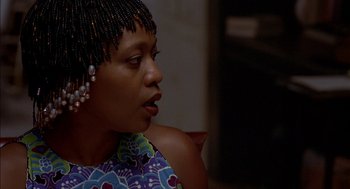 Movie still from “Crooklyn” (1994), directed by Spike Lee – A person with beads in their hair; Close Up shot, Over the shoulder angle