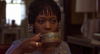 Movie still from “Crooklyn” (1994), directed by Spike Lee – A woman drinking a cup of coffee from a mug; Close Up shot, Low angle