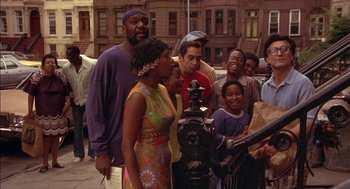 Movie still from “Crooklyn” (1994), directed by Spike Lee – A group of people standing next to a fire hydrant; Wide shot, High angle