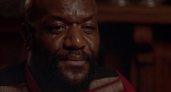 Movie still from “Crooklyn” (1994), directed by Spike Lee – A person with a beard; Close Up shot, Low angle