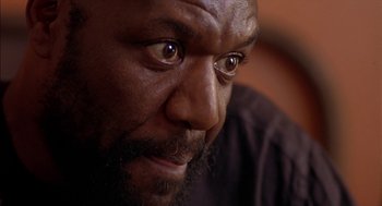 Movie still from “Crooklyn” (1994), directed by Spike Lee – A man's eyes and face; Close Up shot, Low angle