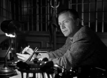 Movie still from “Crossfire” (1947), directed by Edward Dmytryk – A black and white photo of a man writing on a piece of paper; Close Up shot, Low angle