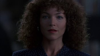 Movie still from “Crossing Delancey” (1988), directed by Joan Micklin Silver – A person with curly brown hair; Close Up shot, Low angle