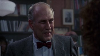 Movie still from “Crossing Delancey” (1988), directed by Joan Micklin Silver – An older man wearing a suit and a bow tie; Close Up shot, Low angle