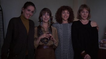 Movie still from “Crossing Delancey” (1988), directed by Joan Micklin Silver – A group of women standing next to each other in a room; Medium shot, Low angle