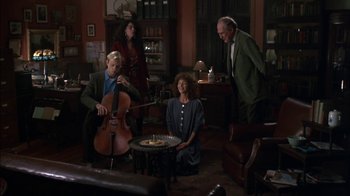 Movie still from “Crossing Delancey” (1988), directed by Joan Micklin Silver – A group of people sitting around a living room; Wide shot, High angle