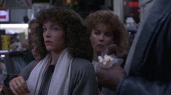 Movie still from “Crossing Delancey” (1988), directed by Joan Micklin Silver – Two women are standing in front of each other; Close Up shot, Over the shoulder angle