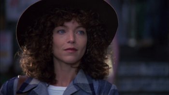 Movie still from “Crossing Delancey” (1988), directed by Joan Micklin Silver – A person wearing a hat and looking to the side; Close Up shot, Low angle