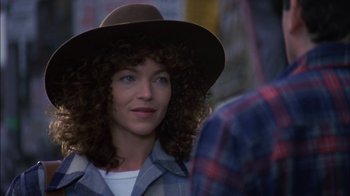 Movie still from “Crossing Delancey” (1988), directed by Joan Micklin Silver – A person wearing a hat; Close Up shot, Over the shoulder angle