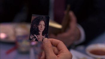 Movie still from “Crossing Delancey” (1988), directed by Joan Micklin Silver – A person holding up an old photo of a woman; Extreme Close Up shot, High angle