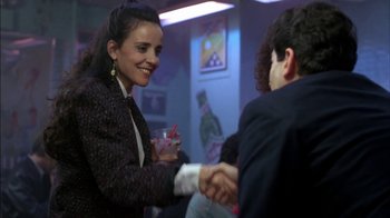 Movie still from “Crossing Delancey” (1988), directed by Joan Micklin Silver – Two people shaking hands in a room; Medium shot, Over the shoulder angle