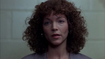 Movie still from “Crossing Delancey” (1988), directed by Joan Micklin Silver – A person with curly brown hair; Close Up shot, Low angle