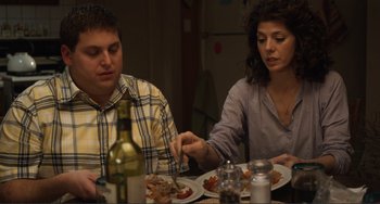 Movie still from “Cyrus” (2010), directed by Jay Duplass – A man and a woman sitting at a dinner table; Medium shot, Over the shoulder angle
