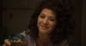 Movie still from “Cyrus” (2010), directed by Jay Duplass – A person sitting in front of a window; Close Up shot, High angle