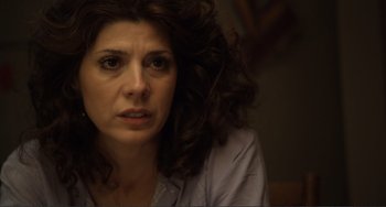 Movie still from “Cyrus” (2010), directed by Jay Duplass – A person with curly hair; Close Up shot, Over the shoulder angle