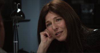 Movie still from “Cyrus” (2010), directed by Jay Duplass – A person with long brown hair; Close Up shot, Over the shoulder angle
