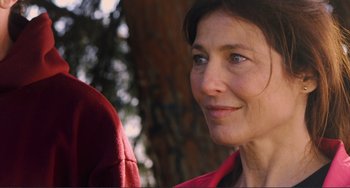 Movie still from “Cyrus” (2010), directed by Jay Duplass – A person wearing a red jacket; Close Up shot, Over the shoulder angle