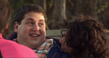 Movie still from “Cyrus” (2010), directed by Jay Duplass – A man and a woman are smiling for the camera; Close Up shot, Over the shoulder angle