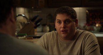 Movie still from “Cyrus” (2010), directed by Jay Duplass – A person sitting in a kitchen; Close Up shot, Over the shoulder angle