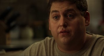 Movie still from “Cyrus” (2010), directed by Jay Duplass – A man's face in a dark room; Close Up shot, Over the shoulder angle