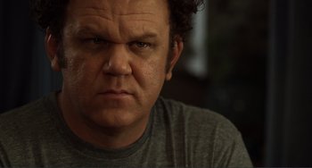 Movie still from “Cyrus” (2010), directed by Jay Duplass – A man with a frowning face; Close Up shot, Low angle