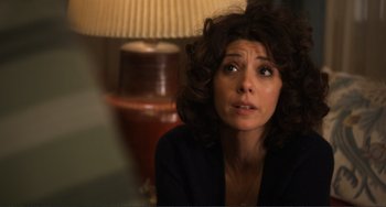 Movie still from “Cyrus” (2010), directed by Jay Duplass – A person sitting in front of a lamp; Close Up shot, Over the shoulder angle