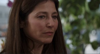 Movie still from “Cyrus” (2010), directed by Jay Duplass – A person with long brown hair; Close Up shot, Over the shoulder angle