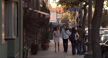Movie still from “Cyrus” (2010), directed by Jay Duplass – A group of people walking down a sidewalk; Wide shot, Over the shoulder angle
