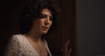 Movie still from “Cyrus” (2010), directed by Jay Duplass – A person with curly hair; Close Up shot, Over the shoulder angle