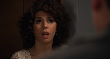 Movie still from “Cyrus” (2010), directed by Jay Duplass – A person with curly brown hair; Close Up shot, Over the shoulder angle