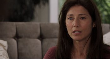 Movie still from “Cyrus” (2010), directed by Jay Duplass – A person sitting on a couch; Close Up shot, Over the shoulder angle