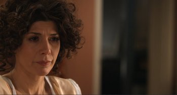 Movie still from “Cyrus” (2010), directed by Jay Duplass – A person with curly brown hair; Close Up shot, Over the shoulder angle