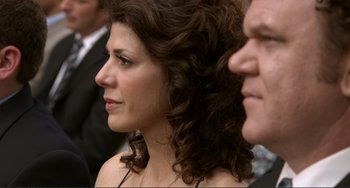 Movie still from “Cyrus” (2010), directed by Jay Duplass – A person wearing a suit and tie; Close Up shot, Over the shoulder angle