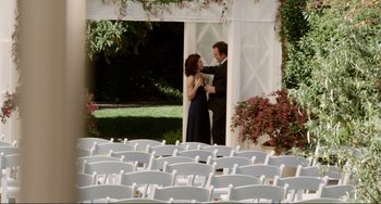 Movie still from “Cyrus” (2010), directed by Jay Duplass – A man and a woman dancing in front of a white tent; Wide shot, High angle