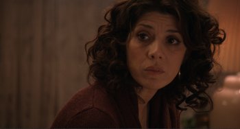 Movie still from “Cyrus” (2010), directed by Jay Duplass – A person with curly hair looking at the camera; Close Up shot, Over the shoulder angle